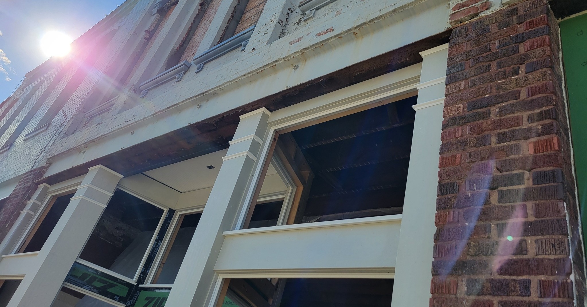 Architectural details on the storefronts are coming together! If you look at the older photo, you can see how they evoke the originals. Thanks to the crew from Evergreen Construction who's building them by hand!