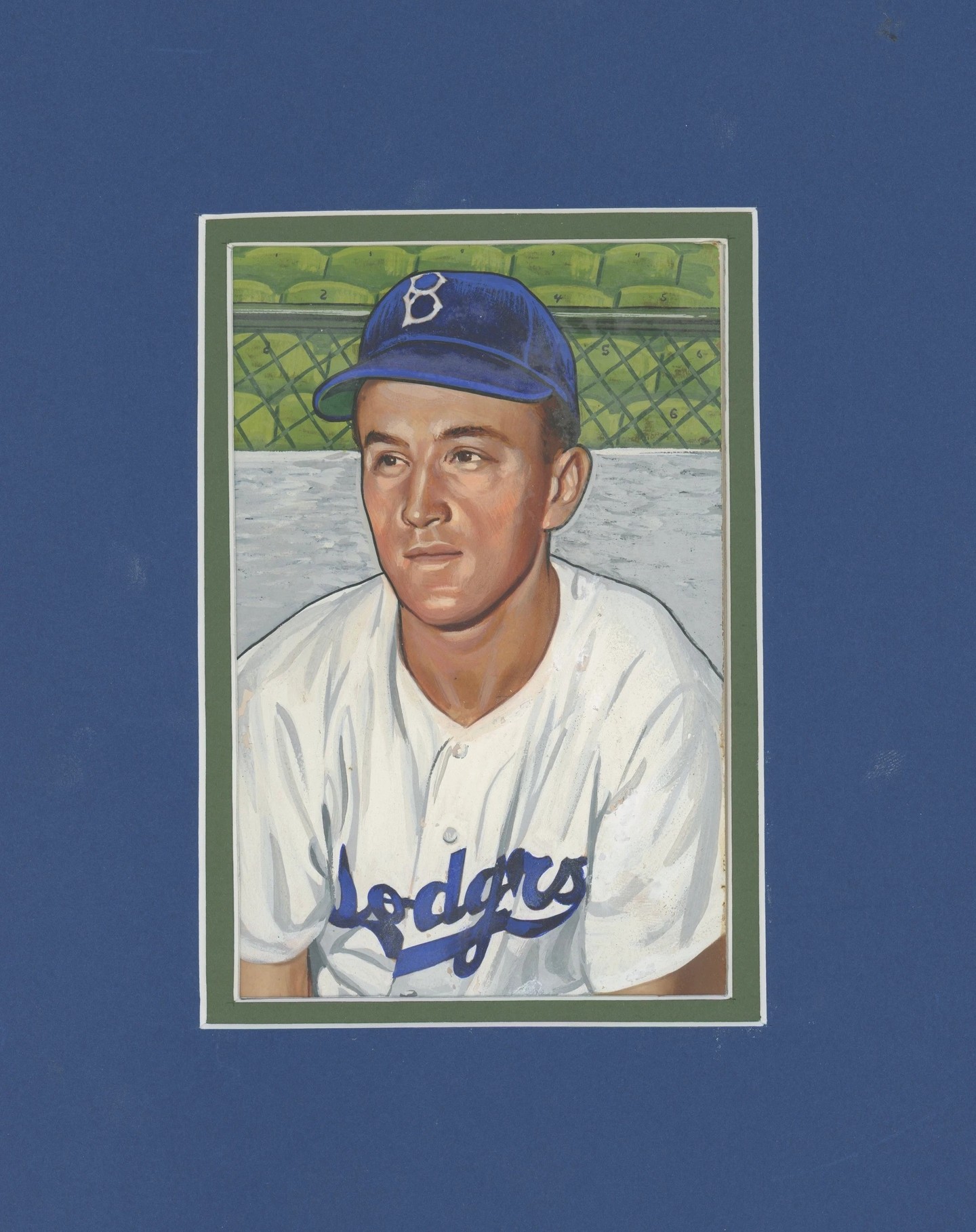 1952 Bowman George Shuba - Original Art for Unissued Card
George Shuba batted 5,337 times as a professional. He played parts of seven years for the Dodgers in the late forties and early fifties, putting up good numbers - an OPS of .771 and an OPS+ of 104. He hit .333 with a 1.000 OPS in limited action in three World Series. He might have been forgotten by history like so many players who had solid careers but for one act of basic human decency preceding one of those 5,337 at bats.
Today, many accounts of Jackie Robinson's integration of major league baseball have the feeling of inevitability. The Instagram-sized story is familiar to all baseball fans: Branch Rickey's determination to sign him; Robinson's courage "not to fight back," Pee Wee Reese's decision to put his arm around his shoulder, and Robinson's spectacular, daring play all led to a new era in baseball and our country. The story is true as far as it goes. The reality was much more complex, however, and the outcome that Robinson achieved was not inevitable.
Opposition to Black men playing major league baseball was widespread, intense, and palpable in 1946 when Robinson began his career in what was patronizingly called "organized baseball." Baseball executives, opposing players, and even many of Robinson's teammates opposed integration. Nobody could be sure of what might happen when Robinson actually broke the color line, which he did in a minor league game on April 18, 1946, playing for the Montreal Royals. Robinson homered in his second plate appearance and there to congratulate him at home was George Shuba. The photographs of Shuba shaking Robinson's hand were published in newspapers across the United States. "The handshake," as it is now known, personified racial tolerance at a critical time, and stands as a small, but notable, record of progress. #vintagebaseballcards #jackierobinson #originalart #bowman #baseball