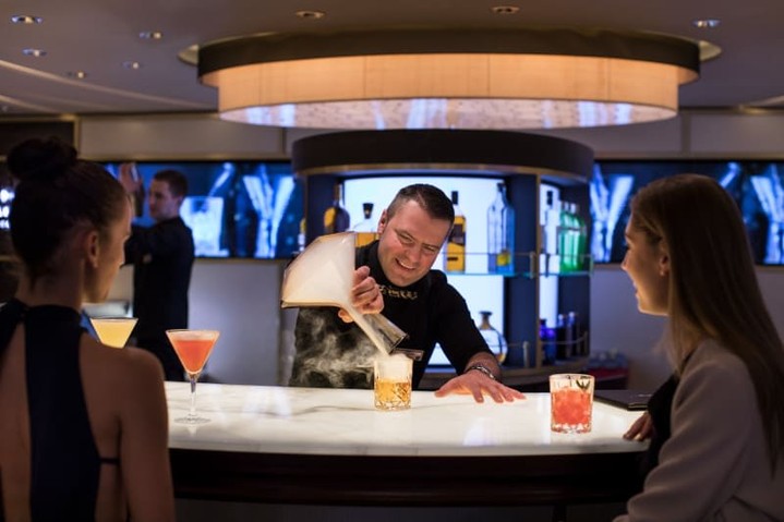 🍸✨ Experience the art of mixology at the World Class Bar aboard the Celebrity Reflection! Indulge in expertly crafted drinks, like the smoky Zacapa in the Clouds, while enjoying exceptional service in a sophisticated atmosphere. This bar promises to elevate your cruise experience. 🌌🥂Ready to sip on something extraordinary? Contact me today to book your cruise and enjoy the luxury of the World Class Bar! 📞#celebrityreflection #cruisedining #bookcelebritycruises#mouseonetravel