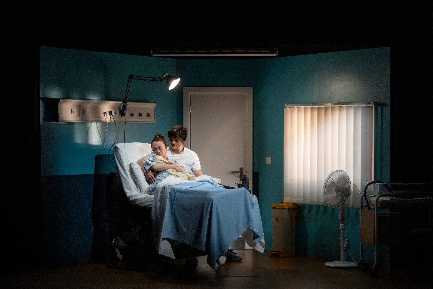 GUESS HOW MUCH I LOVE YOU?
Illusion was so proud to be back in one of our favourite theatres, The Royal Court in their downstairs Jerwood Theatre, providing the set for this heartbreaking story about starting a family, impossible choices, and enduring love.
Written by Luke Norris and directed by Jeremy Herrin, a pregnant couple wait for their 20-week scan, as the future they had planned slips through their fingers.
The set consists of a revolve with four rooms that are sequentially struck during scenes by the crew as soundlessly as possible. A bathroom truck is rolled on after all the rooms have been struck in scene five.
Guess How Much I Love You is currently playing Jan 16th-21st February.
Designer: Grace Smart
Producer / Client: @royalcourttheatre
Production Manager: Zarah Drohan
Project Manager: Zee Cooper
Photos - Johan Persson